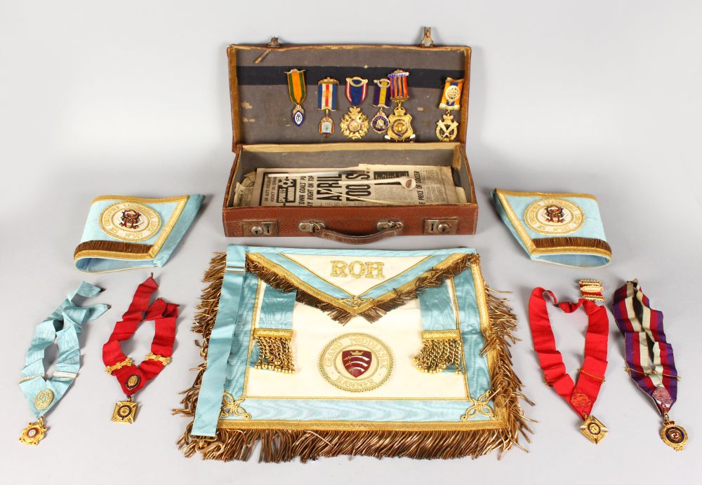 MASONIC REGALIA, in a leather case with gongs, apron and arm bands from CHRISTOPHER LEATHER DALE