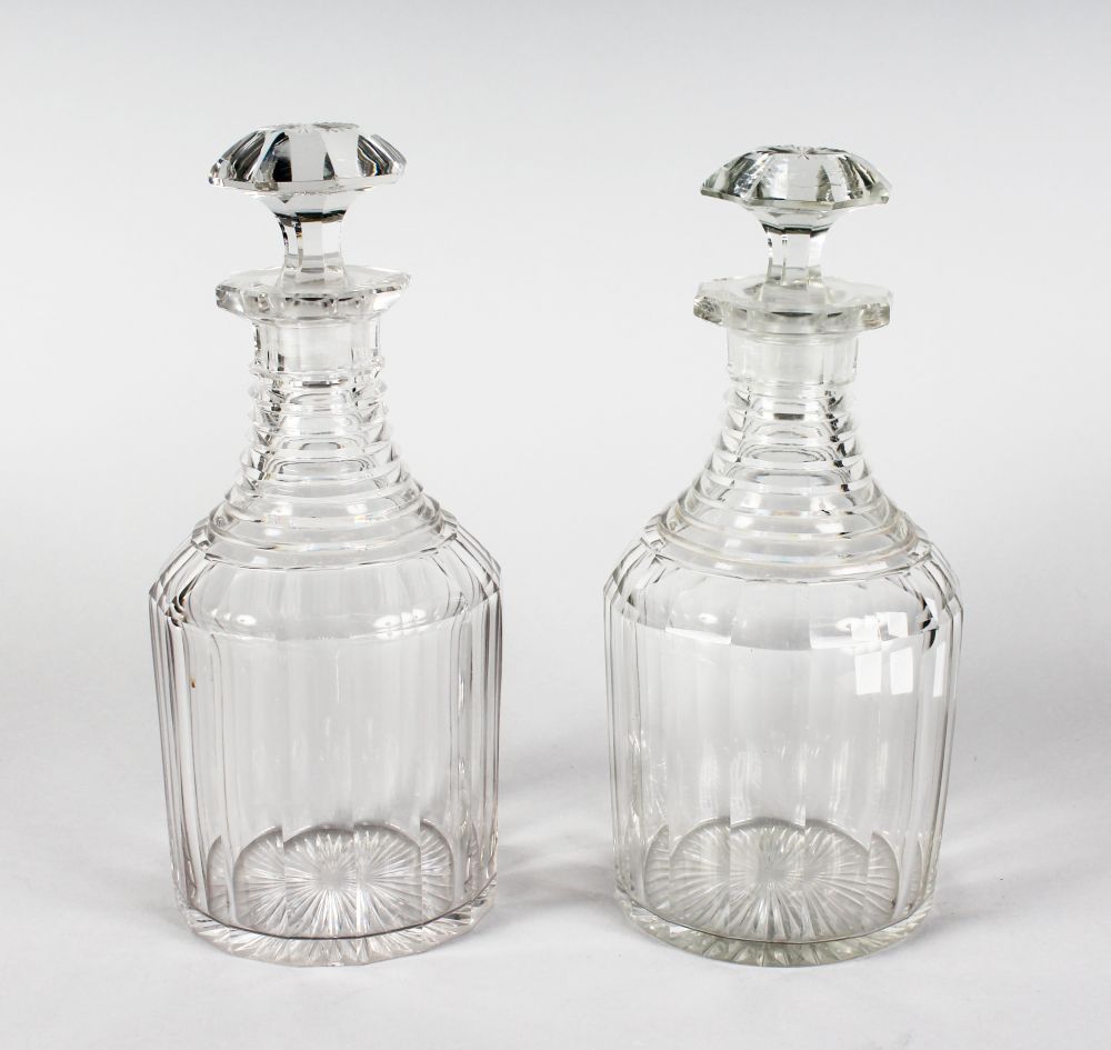 A GOOD PAIR OF SQUARE CUT DECANTERS AND STOPPERS.