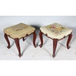 A PAIR OF VICTORIAN SQUARE PADDED STOOLS, with needlework top on cabriole legs.