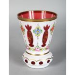 A BOHEMIAN WHITE OVER VASE of thistle shape, painted with flowers. 5ins high.