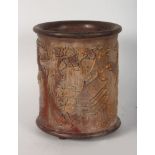 A CHINESE CARVED BAMBOO BRUSH POT, intricately carved with landscapes, temples and trees. 7ins