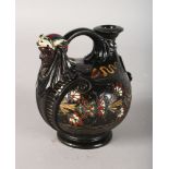A CONTINENTAL POTTERY ISLAMIC DESIGN VASE AND JUG with female mask. 4.5ins high.