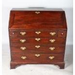 A GEORGE III MAHOGANY BUREAU, brass carrying handles to the sides, fall front, fitted interior and