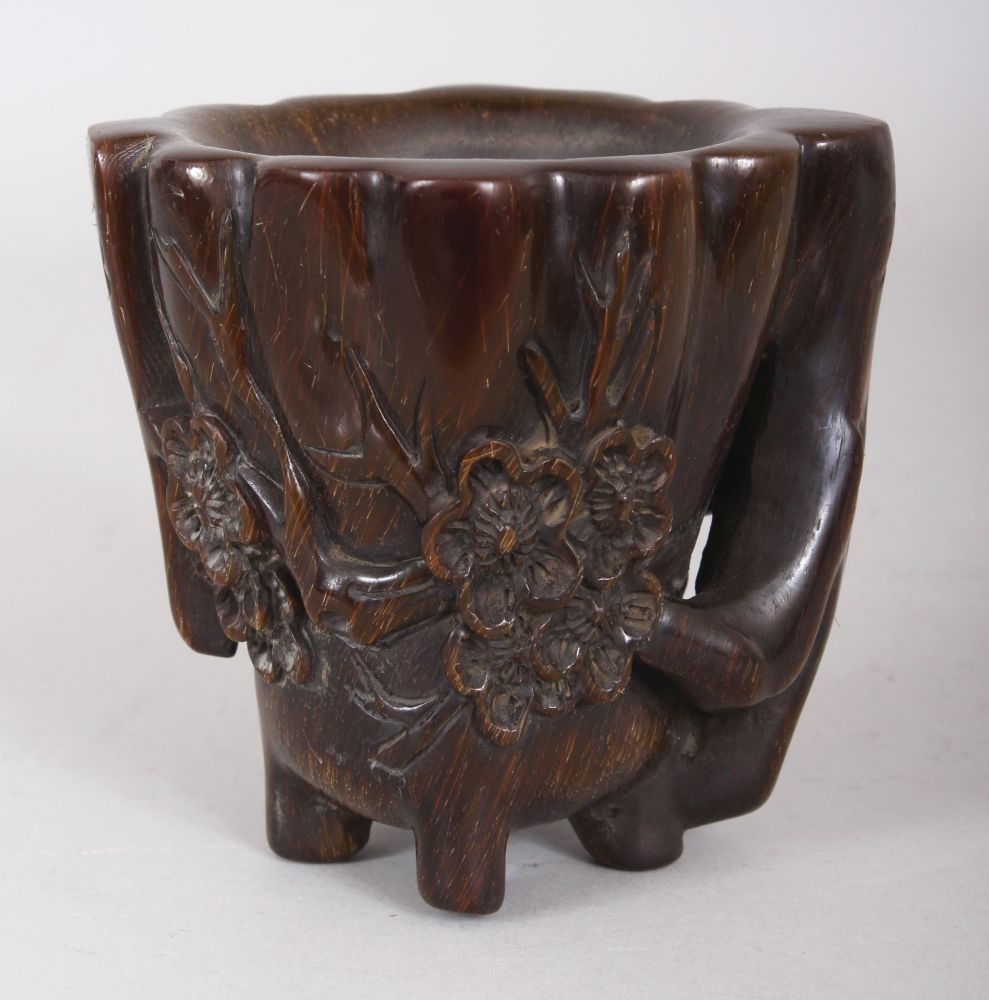 A CHINESE HORN-STYLE CUP, decorated in relief with sprigs of plum blossom, 4.4in high.