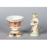 A DERBY FIGURE OF A CUPID, carrying a basket of flowers, 3.5ins high, and A CROWN DERBY VASE, 3ins