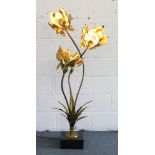 AN UNUSUAL ARTS & CRAFTS GILDED METAL THREE LIGHT LAMP formed as three scrolling flower heads. 5ft