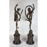 A GOOD PAIR OF BRONZE FIGURES OF MERCURY AND CERES on pedestals. 33ins high.