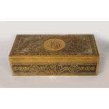 AN ISLAMIC BRASS BOX WITH ARABIC CALLIGRAPHY, stamped Mauser Co., Fifth Avenue., New York. 2ins high