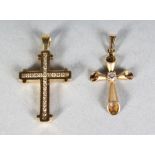 TWO 14CT GOLD CROSSES.