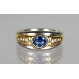 A GOOD 18CT GOLD, DIAMOND AND SAPPHIRE RING.