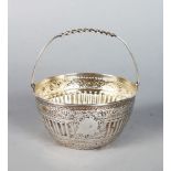 A VICTORIAN CIRCULAR SUGAR BASIN with swing handle. Sheffield 1886.