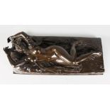 A LARGE BRONZE OF A RECLINING NUDE. 32ins long.