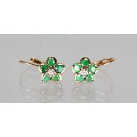 A PAIR OF 10CT GOLD AND EMERALD EARRINGS.