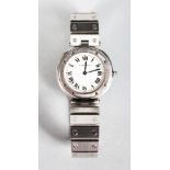 A LADIES CARTIER PANTHER QUARTZ WATCH with brushed steel case and round face.