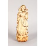 A VERY GOOD 19TH CENTURY IVORY CARVING OF THE MADONNA with gilt decoration. 5.75ins high.