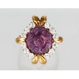 AN 18CT YELLOW GOLD, AMETHYST AND DIAMOND RING in the form of a flower head.