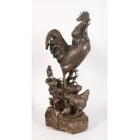 A BRONZE GROUP, FAMILY OF CHICKENS. 22ins high.