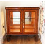 A 19TH CENTURY FRENCH AMBOYNA AND MARBLE SIDE CABINET, with a pair of glazed doors and sides,