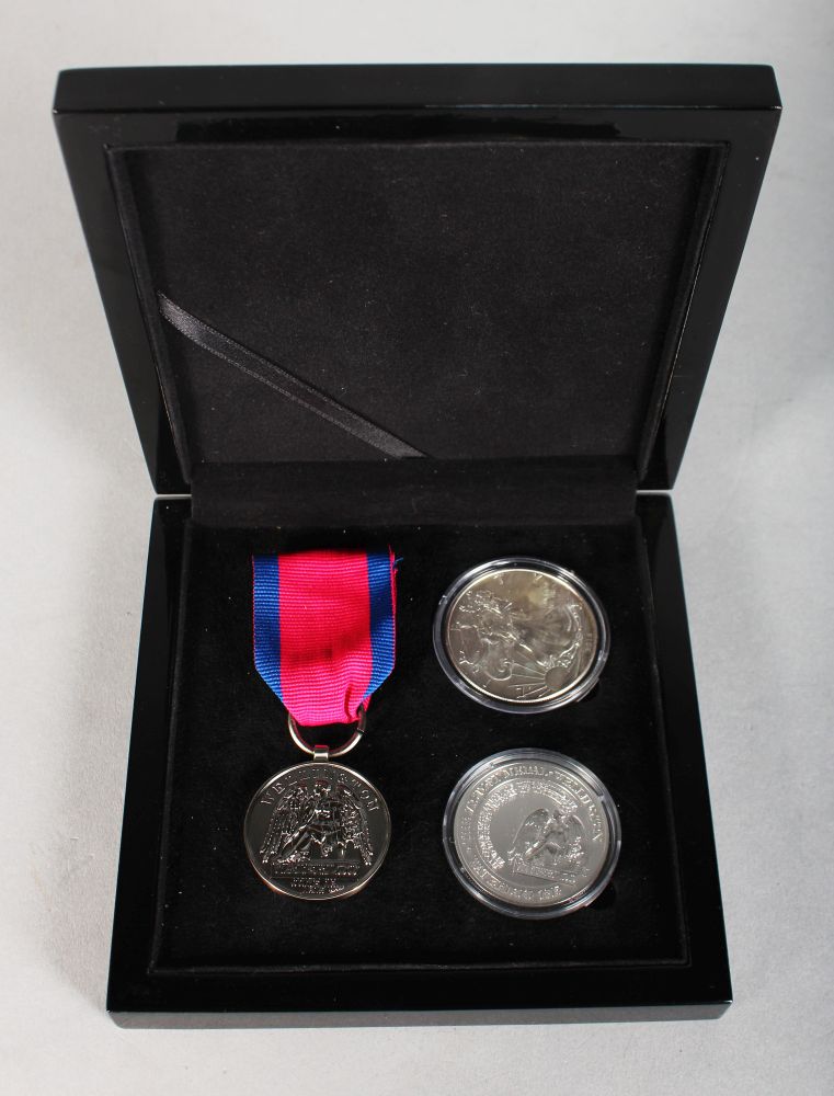 A REPLICA SILVER WATERLOO VICTORY MEDAL AND RIBBON and two silver medals, in a presentation case.