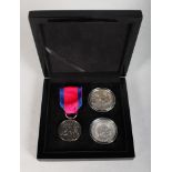 A REPLICA SILVER WATERLOO VICTORY MEDAL AND RIBBON and two silver medals, in a presentation case.