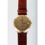 A GENTLEMAN'S GOLD BULOVA WRISTWATCH with leather strap.