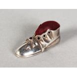 A SILVER NOVELTY SHOE PIN CUSHION.