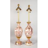 A GOOD PAIR OF 19TH CENTURY FRENCH PINK MARBLE URNS with ormolu mounts as LAMPS, with pineapple