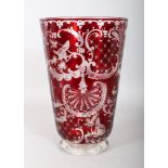 A BOHEMIAN RED GLASS VASE, with engraved decoration. 10ins high.