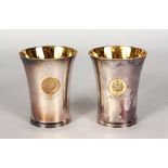 A PAIR OF PRESENTATION BEAKERS. Maker: C. J. Vander. London 1965. 3.75ins high.