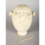 A GOOD CHINESE CARVED IVORY PEDESTAL CUP, with lid, (lid AF), the body carved with various