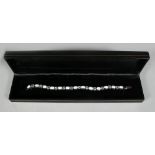 A SILVER AND GILSON OPAL TENNIS BRACELET.