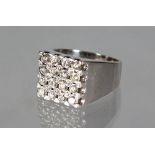 A VERY GOOD 18CT WHITE GOLD DIAMOND SET SQUARE RING.