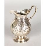 A GEORGE II CREAM JUG, with contemporary engraved decoration. London 1743. 4ins high.