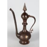 AN EARLY PERSIAN STEEL EWER with gold decoration. 13ins high.