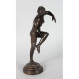 AFTER THE ANTIQUE A STANDING NUDE ON A CIRCULAR BASE. 9.5ins high.