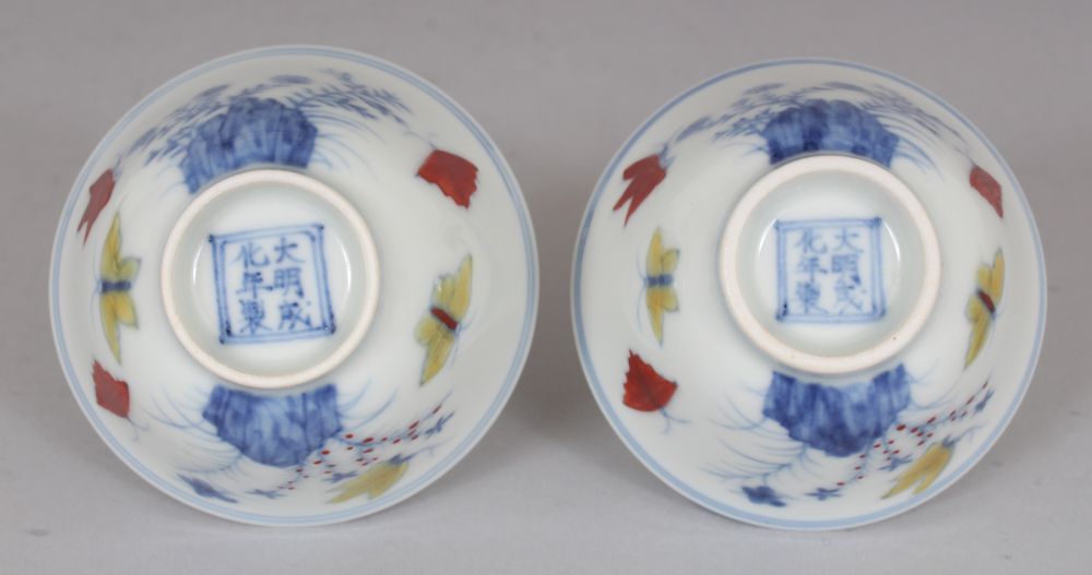 A PAIR OF MING STYLE DOUCAI PORCELAIN CUPS, decorated with butterflies, ferns and rockwork, each - Image 7 of 7