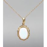 A 9CT YELLOW GOLD GILSON OPAL PENDANT AND CHAIN.