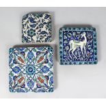 THREE VARIOUS ISLAMIC SQUARE TILES.