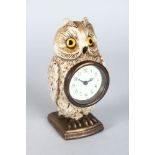 A COLD CAST PAINTED OWL CLOCK. 6,5ins high.