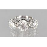 A VERY IMPRESSIVE 18CT WHITE GOLD THREE STONE DIAMOND RING of 7.2CTS.