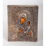 A RUSSIAN SILVER MOUNTED ICON, MADONNA AND CHILD. 8cms x 6cms.