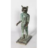 AN EGYPTIAN METAL FIGURE OF A CAT. 1ft 7ins high.