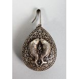 A SILVER DROP PENDANT, decorated in relief with two fish on either side.