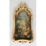 A LATE 18TH CENTURY FRENCH CARVED IVORY FRAMED EASEL PICTURE, the frame with crest and pierced