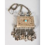 A SILVER ISLAMIC PURSE with chain.