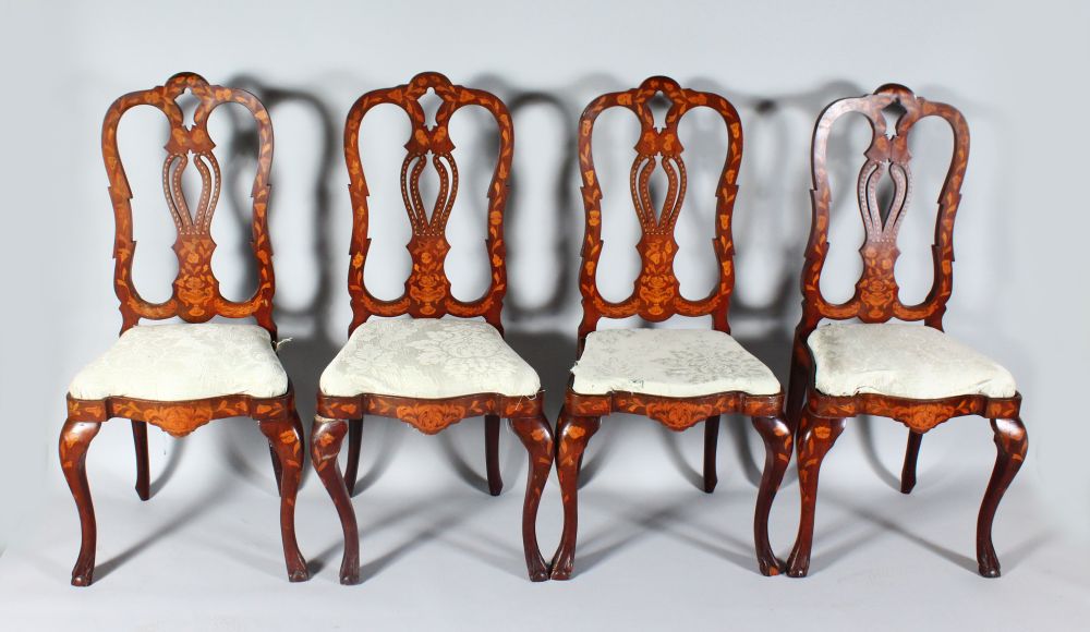 A SET OF FOUR 18TH CENTURY DUTCH MARQUETRY SINGLE CHAIRS with pierced backs and drop-in seats.