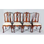 A SET OF FOUR 18TH CENTURY DUTCH MARQUETRY SINGLE CHAIRS with pierced backs and drop-in seats.