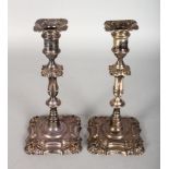 A PAIR OF VICTORIAN SILVER CANDLESTICKS on loaded bases. 9.5ins high. Sheffield 1894.