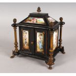 A GOOD 19TH CENTURY VIENNA EBONY AND ENAMEL TABLE CABINET, painted with eleven enamel panels on