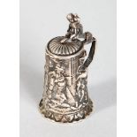 A MINIATURE SILVER TANKARD.